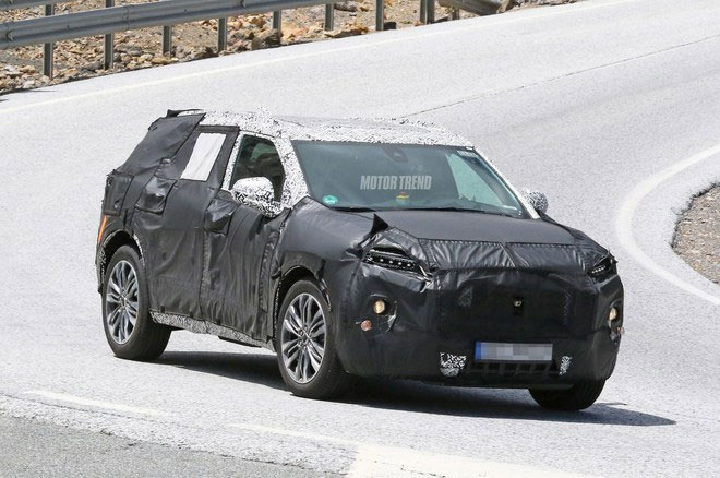 SPIED! CHEVROLET MIDSIZE SUV PEEKS OUT FROM UNDER THE CAMO