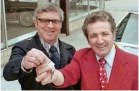 Joe Girard, right, with his first customer, who is shown here buying another car in 1977, shortly before Girard's "retirement."