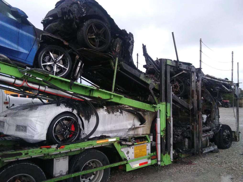 Corvettes on fire on transport truck picture